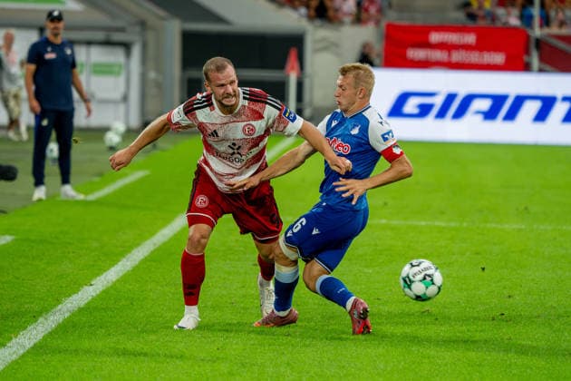 August 15, 2026, xkkux, Soccer, Fortuna Düsseldorf vs. TSG 1899 Hoffenheim II, 3. Liga, MERKUR SPIEL ARENA, Matchday 2, 2026–2027 Season Eric Hottmann of Fortuna Düsseldorf 09 in a tackle against Valentin Lässig of TSG Hoffenheim II 06 DFB regulations prohibit any use of photographs as image sequences and or quasi-video North Rhine-Westphalia, Germany