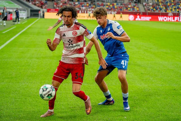 August 15, 2026, xkkux, Soccer, Fortuna Düsseldorf vs. TSG 1899 Hoffenheim II, 3. Liga, MERKUR SPIEL ARENA, Matchday 2, 2026–2027 Season: Anas Slimani (Fortuna Düsseldorf, No. 34) in a tackle against Maximilian Raphael Theuer (TSG Hoffenheim II, No. 47). DFB regulations prohibit any use of photographs as image sequences and or quasi-video. North Rhine-Westphalia, Germany