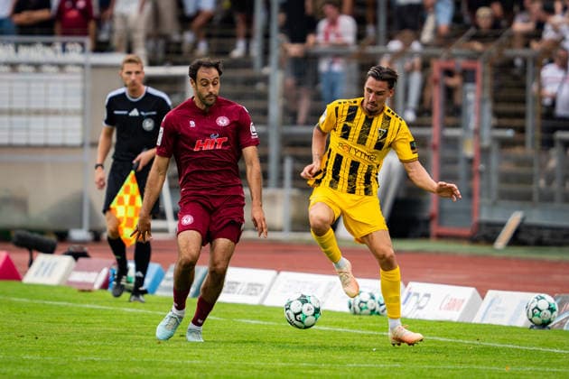 Hamadi Al Ghaddioui, SC Fortuna Cologne, 18, vs. Petros Bagkalianis, Alemannia Aachen, 02; SC Fortuna Cologne vs. Alemannia Aachen, Soccer, 3rd Division, Matchday 2, 2026–2027 Season, August 15, 2026 DFB regulations prohibit any use of photographs as image sequences and or quasi-video SC Fortuna Cologne vs. Alemannia Aachen, soccer, 3. Liga, Matchday 2, 2026–2027 Season, August 15, 2026, Cologne Copyright: xEibner-Pressefoto J.xDerondeaux EP_JDU