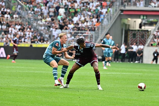 August 15, 2026, Mönchengladbach Soccer, Men s, 2026–2027 season, Friendly match: Borussia Mönchengladbach vs. Aston Villa. A tackle between (from left) Isac Lidberg (Gladbach) and Tyrone Mings (Aston Villa). DFL regulations prohibit any use of photographs as image sequences and or quasi-video content. Borussia Park, North Rhine-Westphalia, Germany