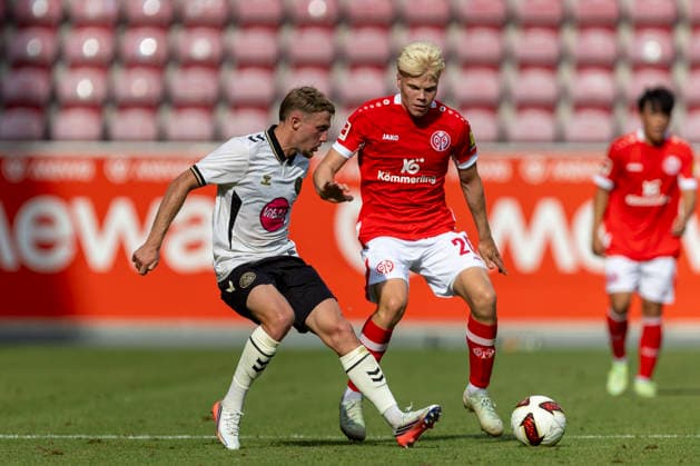 GER, Mainz, Soccer, Friendly Match, FSV Mainz 05 vs. AFC Bournemouth (pictured, from left): Adrien Truffert (AFC Bournemouth 03), Otto Ruoppi (FSV Mainz 05 20), tackle on August 15, 2026, MEWA Arena Mainz DFL DFB REGULATIONS PROHIBIT ANY USE OF PHOTOGRAPHS AS IMAGE SEQUENCES AND OR QUASI-VIDEO, Copyright: HMBxMedia PaulxFritz