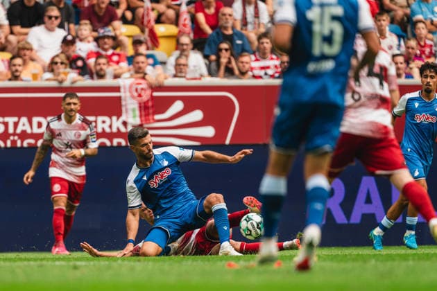 Matthias Zimmermann, Fortuna Düsseldorf, 25, Klaus Gjasula, TSG Hoffenheim II, 05, in a tackle with Jorrit Hendrix, Fortuna Düsseldorf, 08, Matthew Moore, TSG Hoffenheim II, 15, Jomaine Consbruch, Fortuna Düsseldorf, 14, Yasin Zor (TSG Hoffenheim II, 10) Fortuna Düsseldorf vs. TSG Hoffenheim II, Soccer, 3rd Division, Matchday 02, 2026–27 Season, August 15, 2026, DFL regulations prohibit any use of photographs as image sequences and or quasi-video, Fortuna Düsseldorf vs. TSG Hoffenheim II, Soccer, 3. Liga, Matchday 2, 2026–27 Season, August 15, 2026, Düsseldorf Copyright: xEibner-Pressefoto LukasxBaldygax EP_LBA