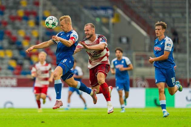 Valentin Laessig of TSG Hoffenheim II, No. 06, heads the ball past the onrushing Eric Hottmann of Fortuna Düsseldorf, 09, Lion Wagenbach (TSG Hoffenheim II, 18), Fortuna Düsseldorf vs. TSG Hoffenheim II, Soccer, 3. Liga, Matchday 2, 2026–27 Season, August 15, 2026, DFL regulations prohibit any use of photographs as image sequences and or quasi-video. Fortuna Düsseldorf vs. TSG Hoffenheim II, soccer, 3. Liga, Matchday 2, 2026–27 Season, August 15, 2026, Düsseldorf Copyright: xEibner-Pressefoto LukasxBaldygax EP_LBA