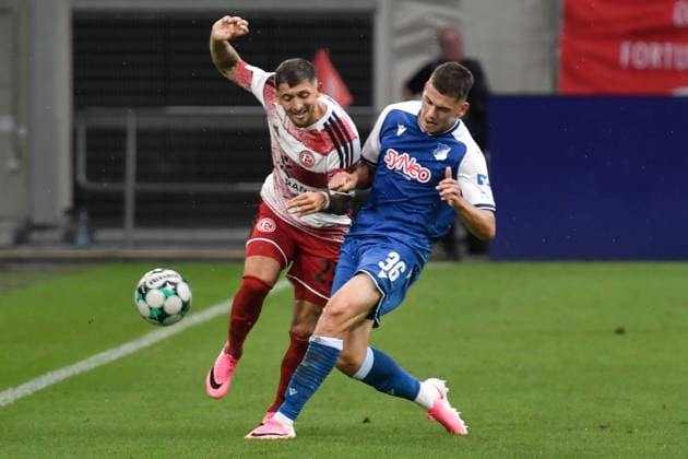 From left in a one-on-one duel: Matthias Zimmermann, Düsseldorf 25; Jakov Dedic, Hoffenheim 36; August 15, 2026 ¢ Soccer ¢ Fortuna Düsseldorf vs. TSG 1899 Hoffenheim II, Merkur Spiel Arena, Düsseldorf, DFB and DFL regulations prohibit any use of photographs as image sequences and or quasi-video. NRW, Germany Copyright: xpepphotox xSaschaxWeizx pep00321, pep_20260815_hm_55823