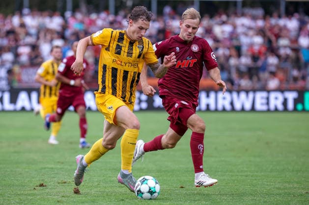 August 15, 2026, xsefx, Soccer, SC Fortuna Köln vs. TSV Alemannia Aachen, 3rd Division, Südstation, Matchday 2, 2026–2027 Season: Georg Strauch of Fortuna Cologne 11 in a tackle against Daniel Starodid of Alemannia Aachen 09. DFB regulations prohibit any use of photographs as image sequences and or quasi-video. North Rhine-Westphalia, Germany
