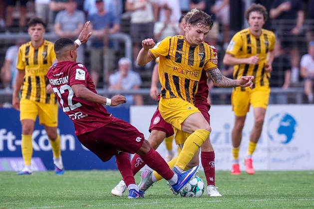 August 15, 2026, xsefx, Soccer, SC Fortuna Köln vs. TSV Alemannia Aachen, 3rd Division, Südstation, Matchday 2, 2026–2027 Season: Daniel Starodid of Alemannia Aachen 09 in a tackle against Robin Afamefuna of Fortuna Cologne 22. DFB regulations prohibit any use of photographs as image sequences and or quasi-video. North Rhine-Westphalia, Germany