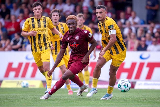 August 15, 2026, xsefx, Soccer, SC Fortuna Köln vs. TSV Alemannia Aachen, 3rd Division, Südstation, Matchday 2, 2026–2027 Season: Romeo Aigbekaen (Fortuna Cologne, No. 30) in a tackle with Mika Hanrath (Alemannia Aachen, No. 15). DFB regulations prohibit any use of photographs as image sequences and or quasi-video. North Rhine-Westphalia, Germany