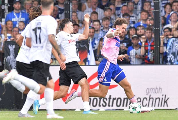August 15, 2026, GER, Soccer, 3rd Division, 2026–2027 Season, Matchday 2, Sportclub Arena, Verl SC Verl vs. MSV Duisburg 2–4 Felix Vogler (SC Verl) fouls Lex Tyger Lobinger (MSV Duisburg) from the left in the penalty area—a clear penalty. Referee Felix Wagner awards a penalty kick. Action, duel, tackle, foul
