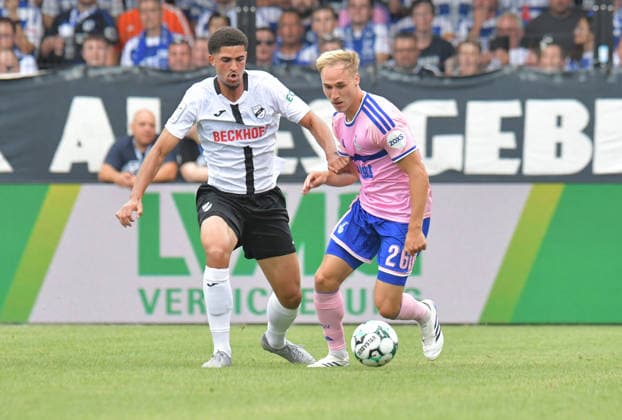 August 15, 2026, GER, Soccer, 3rd Division, 2026–2027 Season, Matchday 2, Sportclub Arena, Verl SC Verl vs. MSV Duisburg 2–4, Raphael Araoye (SC Verl), on the left against Florian Krüger (MSV Duisburg), action, duel, tackle