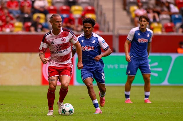 15 08 2026, GER, Soccer, Gentlemen, 3 League , Season 2026 2027, Fortuna Dusseldorf TSG Hoffenheim II Jorrit Hendrix F95 and Tiago Bollard TSG II in Fight to the Ball Copyright: xSvenxHanischx