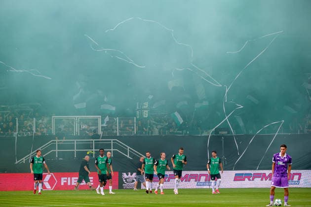 August 15, 2026, xsscx, Soccer 3rd Division, Preußen Münster vs. FC Ingolstadt 04, Matchday 2, LVM Preußenstadion, 2026–2027 Season: Green smoke fills the stadium following a choreographed display by Preußen Münster fans to inaugurate the new Fiffi Gerritzen Curve. DFB regulations prohibit any use of photographs as image sequences and or quasi-video. North Rhine-Westphalia, Germany