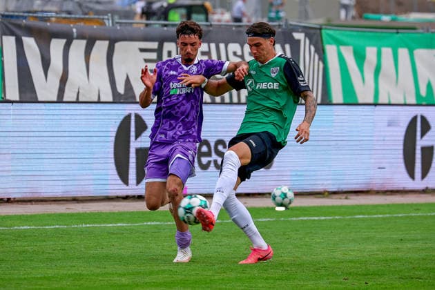 August 15, 2026, xsscx, Soccer 3rd Division, Preußen Münster vs. FC Ingolstadt 04, Matchday 2, LVM Preußenstadion, 2026–2027 Season: Davide Danilo Sekulovic of FC Ingolstadt 33 in a tackle against Marvin Schulz of SC Preußen Münster 10. DFB regulations prohibit any use of photographs as image sequences and or quasi-video. North Rhine-Westphalia, Germany