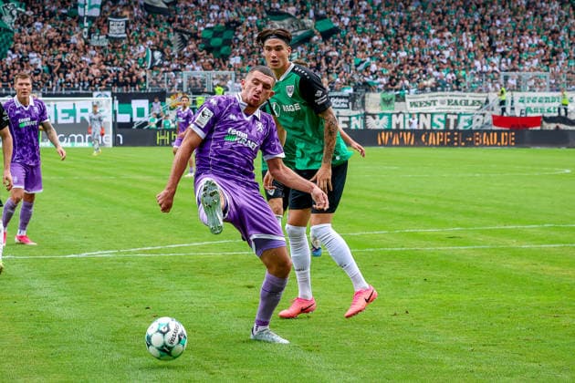 August 15, 2026, xsscx, Soccer 3rd Division, Preußen Münster vs. FC Ingolstadt 04, Matchday 2, LVM Preußenstadion, 2026–2027 Season: Ognjen Drakulic (FC Ingolstadt 30) in a tackle against Marvin Schulz (SC Preußen Münster 10). DFB regulations prohibit any use of photographs as image sequences and or quasi-video. North Rhine-Westphalia, Germany