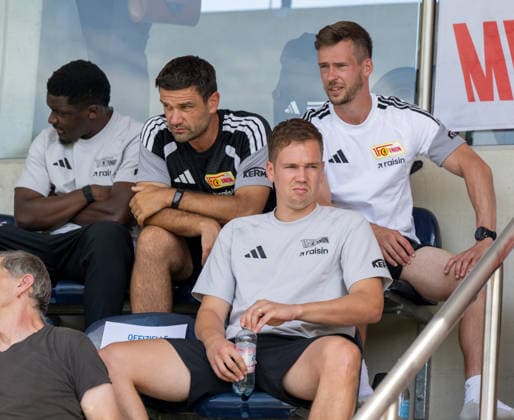 Soccer, Men s, 2026–2027 Season, Friendly match in Salzburg: 1. FC Union Berlin vs. Aris Limassol FC; from left: Stanley Nsoki (1. FC Union Berlin), Dr. Srdan Popovic (sports scientist and running analysis expert), goalkeeper Matheo Raab (1. FC Union Berlin), and rehabilitation coach Johannes Thienel (1. FC Union Berlin) in the stands, August 9, 2026, Copyright: xMatthiasxKochx