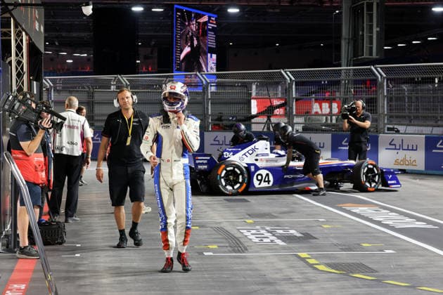 Max Schoner (GER), physical therapist, and Nico Mueller (SUI), Porsche, while behind them, teammate Pascal Wehrlein (GER), Porsche, is being pushed back to the pits; Free Practice 3, pit lane, FIA Formula E World Championship, Season 12, London E-Prix, August 16, 2026, Excel Exhibition Centre,