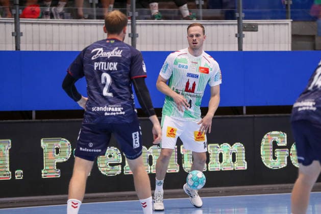 August 16, 2026, xgox, Handball Wartburg Cup: SC Magdeburg vs. SG Flensburg Handewitt, emspor; from left: Simon Pytlick (Flensburg), 2; Omar Ingi Magnusson (Magdeburg), 14; duel, battle, tackle, Eisenach