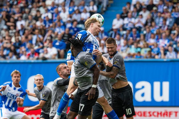 Rostock, Germany, August 16, 2026; 3. Liga 2026–2027, Matchday 2: FC Hansa Rostock vs. SV Waldhof Mannheim; Pictured, second from left: Andreas Voglsammer of Hansa Rostock in a header duel Copyright: xFotostandx xVoelkerx