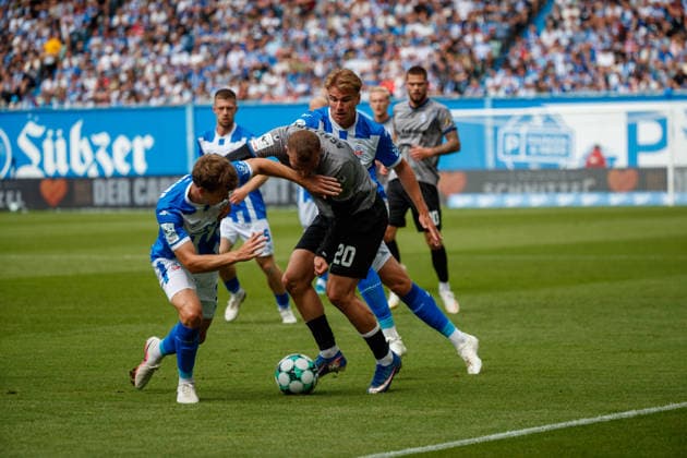 From left: Florian Bohnert (Rostock), Kushtrim Asallari (Waldhof), and Florian Carstens (Rostock) GER; FC Hansa Rostock vs. SV Waldhof Mannheim; Soccer; Men; 3rd Division; Matchday 2; 2026–2027 season; August 16, 2026, Rostock Ostseestadion, Mecklenburg-Western Pomerania, Germany