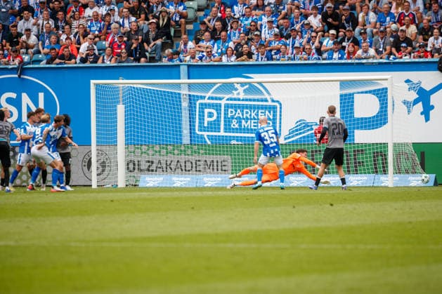 No. 9 Andreas Voglsammer of Rostock scores the 1-2 goal against Jan Niemann of Waldhof GER; FC Hansa Rostock vs. SV Waldhof Mannheim; Soccer; Men; 3rd Division; Matchday 2; 2026–2027 Season; August 16, 2026, Rostock Ostseestadion, Mecklenburg-Western Pomerania, Germany