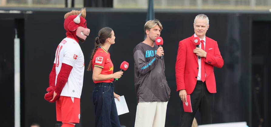 RB Leipzig – Bundesliga Season Opener, Leipzig, August 16, 2026, Festival Grounds in front of the Red Bull Arena, Soccer, Bundesliga 1, RB Leipzig, Season Opener, Pictured: Season Heat Up 2026 mascot Bulli, RB stadium host Clara Mohr, special guest Kevin Kampl, RB stadium announcer Tim Thoelke, For editorial use only, Picture Point