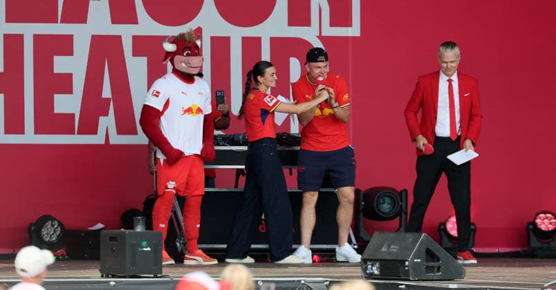 RB Leipzig – Bundesliga Season Opener, Leipzig, August 16, 2026, Festival Grounds in front of the Red Bull Arena, Soccer, Bundesliga 1, RB Leipzig, Season Opener, Pictured: Season Heat Up 2026 stage, RBL mascot Bulli, RB stadium announcer Clara Mohr, Conrad Harder 9, RB Leipzig, RB stadium announcer Tim Thoelke, For editorial use only, Picture Point