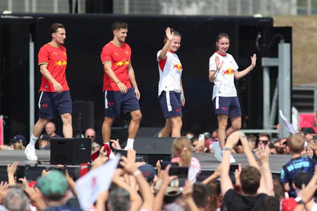 RB Leipzig Season Opener Season Heat Up, August 16, 2026. From left: Rocco Reitz, 20, new signing for RB Leipzig; Christoph Baumgartner, 14; RB Leipzig, Annabel Schasching, 16, RB Leipzig, and Sara Pusztai, 18, RB Leipzig. Bundesliga soccer, 2026–2027 season. RB Leipzig’s Season Heat Up season opener on August 16, 2026, at the Festwiese next to the Red Bull Arena Copyright: xBEAUTIFULxSPORTS JanxKaeferx