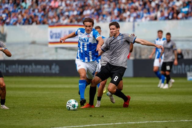 Left: Benno Dietze (Rostock) vs. Maximilian Thalhammer (Waldhof), FC Hansa Rostock vs. SV Waldhof Mannheim, Soccer, Men, 3rd Division, Matchday 2, 2026–2027 Season, August 16, 2026, Rostock Ostseestadion, Mecklenburg-Western Pomerania, Germany