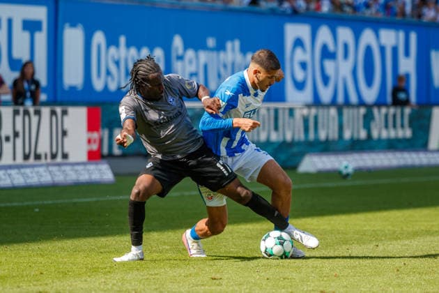 Left: Darnell Keumo (Waldhof) vs. Ouassim Karada (Rostock), GER, FC Hansa Rostock vs. SV Waldhof Mannheim, Soccer, Men, 3rd Division, Matchday 2, 2026–2027 Season, August 16, 2026, Rostock Ostseestadion, Mecklenburg-Western Pomerania, Germany