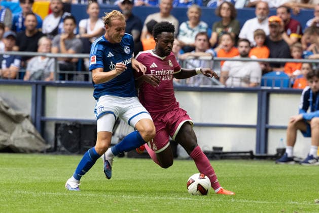 Gelsenkirchen, Germany, August 16, 2026, Timo Becker of FC Schalke 04 and Vinicius Junior of Real Madrid in a duel during the friendly match between FC Schalke 04 and Real Madrid at the Veltins Arena in Gelsenkirchen. Photo by Joachim Bywaletz. DFB and DFL regulations prohibit any use of photographs as IMAGE SEQUENCES AND OR QUASI-VIDEO Copyright: JoachimxBywaletz xJB-Sportfoto
