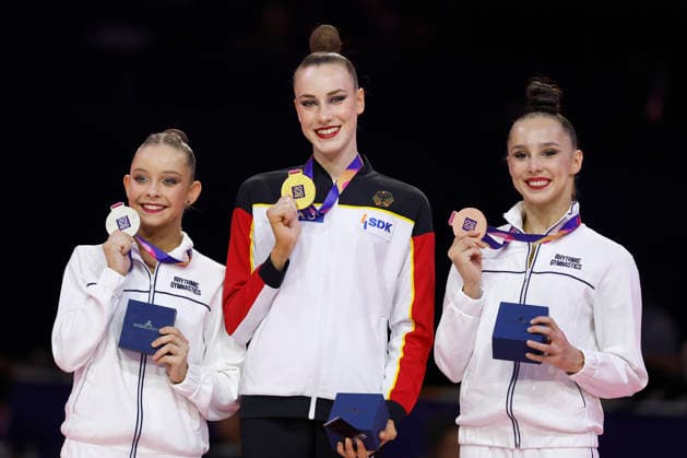 Medal Ceremony for the Ball Final at the 2026 Rhythmic Gymnastics World Championships in Frankfurt am Main, Germany, on August 16, 2026: from left, Sofija Ilterjakowa (Neutral Athlete), silver; Darja Varfolomeev (Germany), gold; and Mariia Borisowa (Neutral Athlete), bronze, with their medals. Medal ceremony for the ball final at the 2026 Rhythmic Gymnastics World Championships in Frankfurt am Main, Germany, on August 16, 2026; from left to right: Sofija Ilterjakowa, individual neutral athlete, silver; Darja Varfolomeev, Germany, gold; and Mariia Borisowa, individual neutral athlete, bronze, with their medals Copyright: HMBxMedia xHeikoxBecker