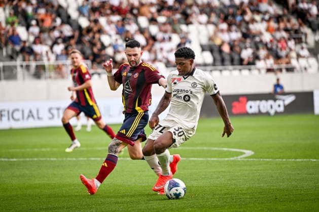 LUGANO, SWITZERLAND, AUGUST 16 — Dereck Moncada of Lugano shields the ball from Dusan Cvetkovic of Vedeggio during the Swiss Cup match between Vedeggio Calcio and FC Lugano at the AIL Arena on August 16, 2026, in Lugano, Switzerland. Lugano, AIL Arena, Ticino, Switzerland Copyright: xJustPictures.ch AndreaxBrancax jp-en-EuSpIm-AB_16082026_4675