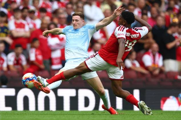 Elliott Anderson of Manchester City is caught late by Myles Lewis-Skelly of Arsenal Arsenal v Manchester City, FA Community Shield, Football, Principality Stadium, Cardiff, Wales, UK - 16 Aug 2026Cardiff Principality Stadium Wales United Kingdom EDITORIAL USE ONLY No use with unauthorised audio, video, data, fixture lists, club league logos or live services. Online in-match use limited to 120 images, no video emulation. No use in betting, games or single club league player publications. Copyright: xKieranxMcManus Shutterstockx 17070166bh