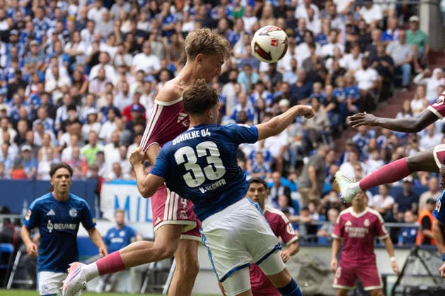 Dean Huijsen of Real Madrid and Vitalie Becker of FC Schalke 04 in a tackle in Gelsenkirchen, Germany, August 16, 2026, during the friendly match between FC Schalke 04 and Real Madrid at the Veltins Arena in Gelsenkirchen. Photo by Joachim Bywaletz. DFB and DFL regulations prohibit any use of photographs as image sequences and or quasi-video. Copyright: JoachimxBywaletz xJB-Sportfoto