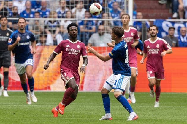 Gelsenkirchen, Germany, August 16, 2026, Vinicius Junior of Real Madrid and Vitalie Becker of FC Schalke 04 in a duel during the friendly match between FC Schalke 04 and Real Madrid at the Veltins Arena in Gelsenkirchen. Photo by Joachim Bywaletz. DFB and DFL regulations prohibit any use of photographs as IMAGE SEQUENCES AND OR QUASI-VIDEO Copyright: JoachimxBywaletz xJB-Sportfoto