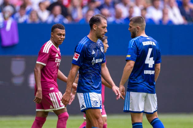 August 15, 2026, Soccer, Friendly Match: FC Schalke 04 vs. Real Madrid CF; Kylian Mbappé (Real Madrid CF) and Nikola Katic (FC Schalke 04) in discussion; Gelsenkirchen, Veltins Arena, North Rhine-Westphalia, Germany; xRHR; PHOTO: DEx Copyright: DennisxEwert RHR-FOTOx RHR-FOTO DE