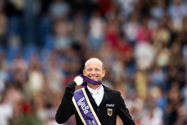 August 16, 2026: Michael Jung of Germany celebrates on the podium after winning the individual gold medal in the Eventing Show Jumping Final on Day 6 of the 2026 FEI World Championships, 2026 in Aachen. Photo by Emma Wallskog, BILDBYRAN, code EW EW0687. equestrian sports, riding, 2026 World Championships, 2026 FEI World Championships, BBENG, equestrian sports, World Championships, eventing  Copyright: EMMAxWALLSKOG BB260816EW055