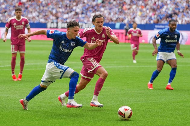 August 16, 2026, xydrx, Men s, Soccer, Friendly Match, FC Schalke 04 vs. Real Madrid, 2026–2027 Season, Veltins Arena: Soufiane El Faouzi (FC Schalke 04), No. 23, in a tackle against Alvaro Carreras (Real Madrid), No. 18. DFB regulations prohibit any use of photographs as image sequences and or quasi-video. Copyright: HMBxMedia YannisxDreimann
