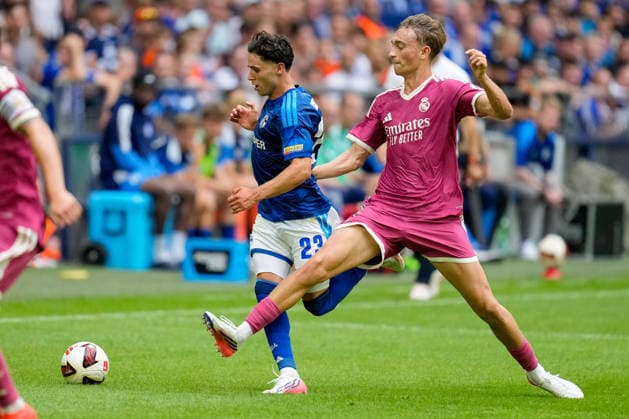 Soufiane El Faouzi of FC Schalke 04 and Dean Huijsen of Real Madrid CF battle for the ball during the preseason friendly match between FC Schalke 04 and Real Madrid at Veltins Arena on August 16, 2026, in Gelsenkirchen, Germany. Photo by Alex Gottschalk, DeFodi Images