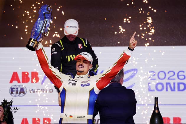 World Champion Pascal Wehrlein (GER) of Porsche poses on the podium with the World Championship trophy, savoring the moment of victory at the FIA Formula E World Championship, Season 12, London E-Prix, August 16, 2026, Excel Exhibition Center, Race 2