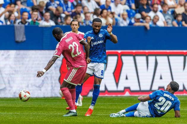 Antonio Rüdiger of Real Madrid CF and Moussa Sylla of FC Schalke 04 battle for the ball during the preseason friendly match between FC Schalke 04 and Real Madrid at Veltins Arena on August 16, 2026, in Gelsenkirchen, Germany. Photo by Mario Hommes, DeFodi Images