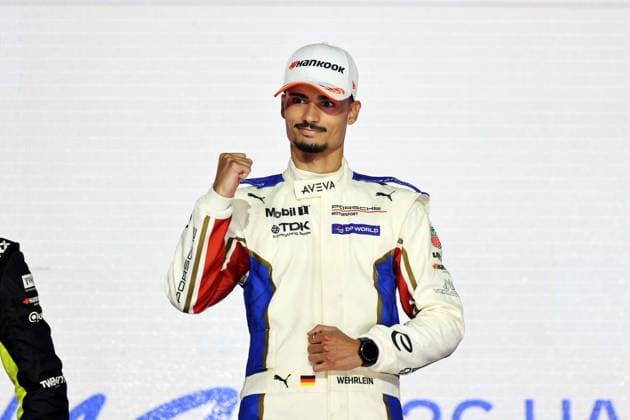 World Champion Pascal Wehrlein (GER) of Porsche poses on the podium with the World Championship trophy, savoring the moment of victory at the FIA Formula E World Championship, Season 12, London E-Prix, August 16, 2026, Excel Exhibition Center, Race 2