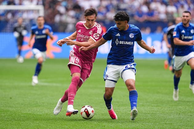 August 16, 2026, xydrx, Men s, Soccer, Friendly Match, FC Schalke 04 vs. Real Madrid, 2026–2027 Season, Veltins Arena, Carlos Espi (Real Madrid), 19, in a tackle against Mertcan Ayhan (FC Schalke 04), 43. DFB regulations prohibit any use of photographs as image sequences and or quasi-video. Copyright: HMBxMedia YannisxDreimann
