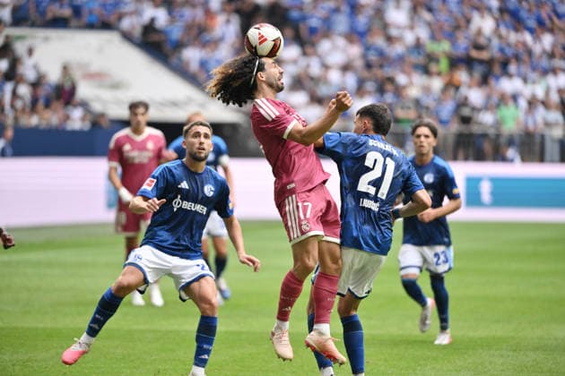Marc Cucurella (Real Madrid, center) against Adil Aouchiche (FC Schalke 04, left) and Dejan Ljubicic (FC Schalke 04) on August 16, 2026, Soccer, Bundesliga 1, 2026–2027 season, friendly match, FC Schalke 04 vs. Real Madrid, Gelsenkirchen, Veltins Arena, North Rhine-Westphalia, Germany Team2