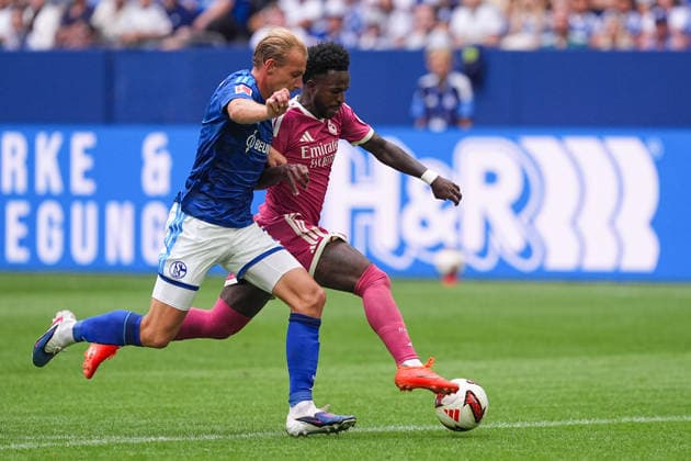 August 16, 2026, xydrx, Men s, Soccer, Friendly Match, FC Schalke 04 vs. Real Madrid, 2026–2027 Season, Veltins Arena, Timo Becker (FC Schalke 04), No. 5 in a tackle against Vinicius Junior (Real Madrid), No. 7. DFB regulations prohibit any use of photographs as image sequences and or quasi-video. Copyright: HMBxMedia YannisxDreimann