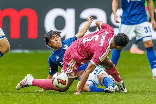 Satoshi Tanaka of FC Schalke 04 and Jude Bellingham of Real Madrid CF battle for the ball during the preseason friendly match between FC Schalke 04 and Real Madrid at Veltins Arena on August 16, 2026, in Gelsenkirchen, Germany. Photo by Mario Hommes, DeFodi Images