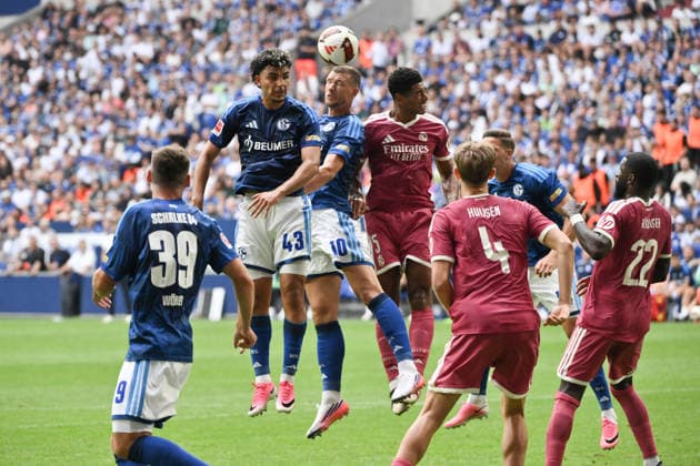 Heading duel: Mertcan Ayhan (Schalke 04), Edin Dzeko (FC Schalke 04), Jude Bellingham (Real Madrid), from left, August 16, 2026, Soccer, Bundesliga 1, 2026–2027 season, Friendly Match, FC Schalke 04 vs. Real Madrid, Gelsenkirchen, Veltins Arena, North Rhine-Westphalia, Germany Team2