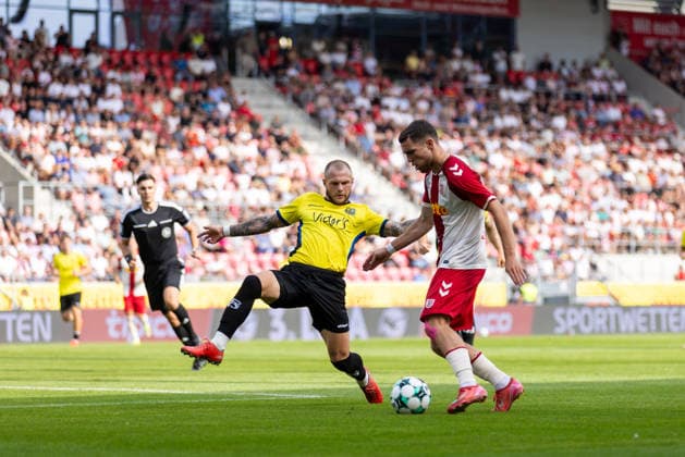 August 16, 2026, Soccer, GER, Season, 3rd Division, 2026–2027 Season, Matchday 2, SSV Jahn Regensburg vs. 1. FC Saarbrücken, Oscar Schönfelder of SSV Jahn Regensburg in action against Philip Noah Fahrner of Saarbrücken. DFL regulations prohibit any use of photographs as image sequences and or quasi-video.
