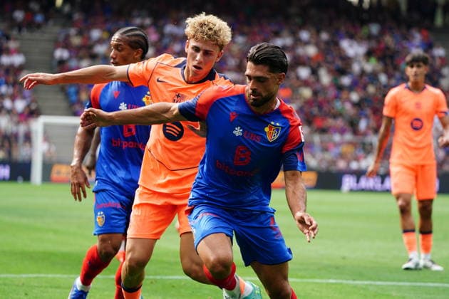 August 16, 2026, Switzerland, Basel, St. Jakob Park, Men s Soccer, 2026–2027 Season, Friendly Match: FC Basel vs. FC Barcelona, 2–5, Photo: Fermin Lopez (FC Barcelona) vs. Nicolas Vouilloz (FC Basel), Reaction, Tackle