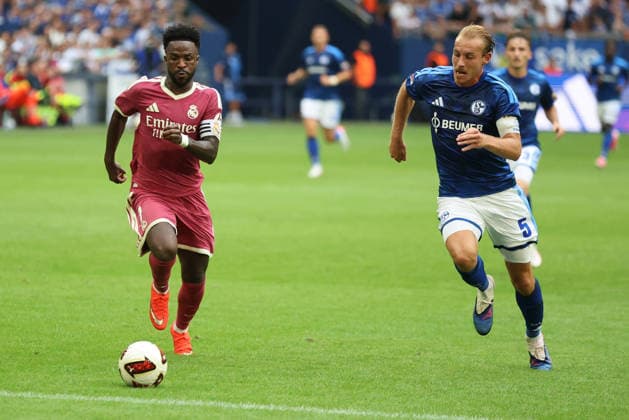 Vinicius Junior of Real Madrid and Timo Becker of FC Schalke 04 during the exhibition match between FC Schalke 04 and Real Madrid CF. Copyright Thomas Pakusch Copyright: Thomas Pakusch