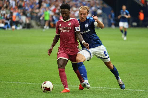 Vinicius Junior of Real Madrid and Timo Becker of FC Schalke 04 during the exhibition match between FC Schalke 04 and Real Madrid CF. Copyright Thomas Pakusch Copyright: Thomas Pakusch